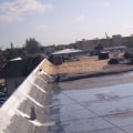 Damage to Commercial Roofs: Understanding the Causes and Solutions